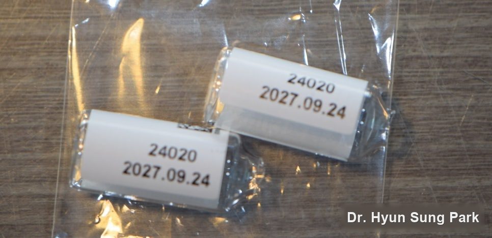 Two implant packaging labels showing lot numbers and expiry dates